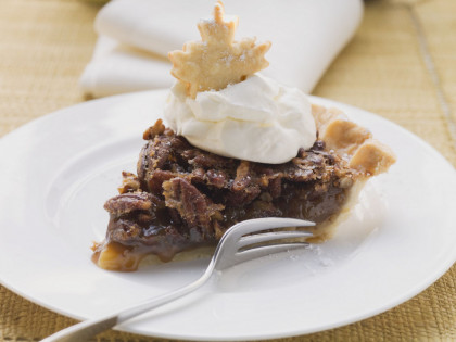 Festive pecan pie with cream topping