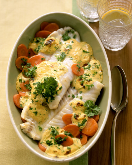 Baked coley on carrots with mustard