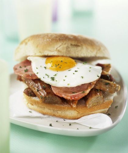 Sausage, bacon and fried egg sandwich