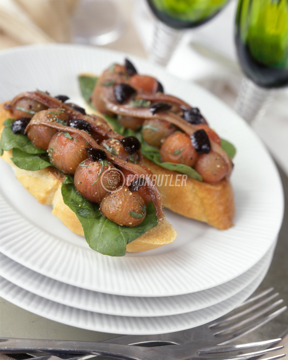 Bruschetta with peeled tomatoes, olives and anchovies | preview