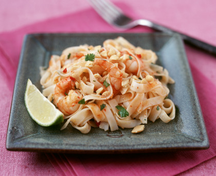 Stir-fried Asian noodles with nuts and prawns