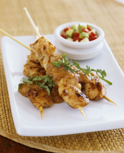 Chicken kebabs with peanut sauce and avocado salad