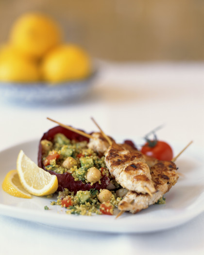 Grilled chicken kebabs with couscous and vegetable salad