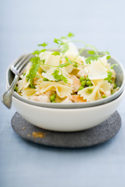Pasta salad with chicken breast, peas, Parmesan and sesame seeds