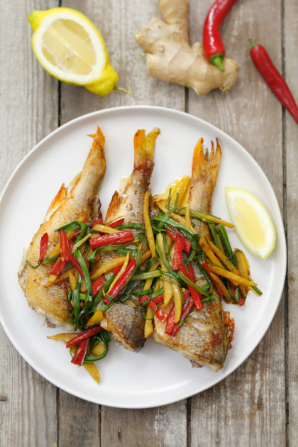 Sea bass with peppers, ginger, chilli and spring onions