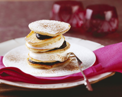 Bohemian sour cream pancakes with plum jam and whipped cream