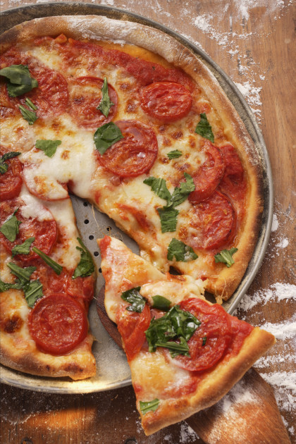 Cheese and tomato pizza with basil