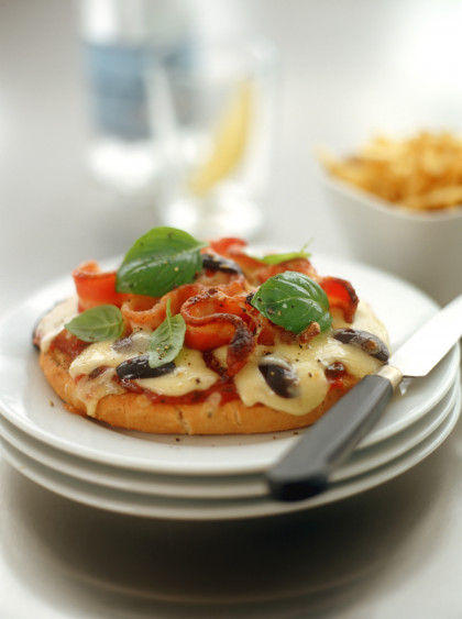 Mini-pizzas with bacon and olives