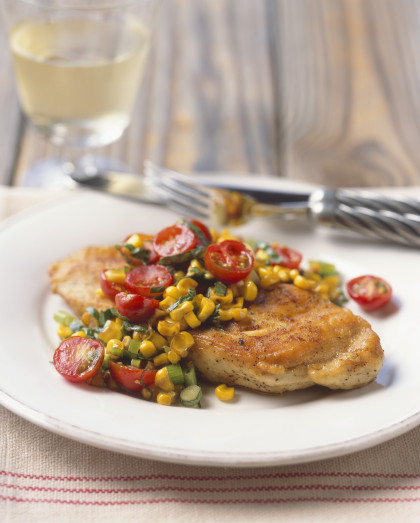 Chicken breast topped with corn and tomato salsa