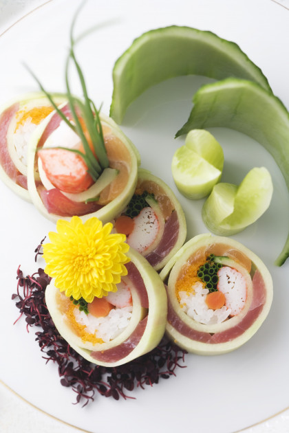 Cucumber rolls filled with crab, salmon and tuna