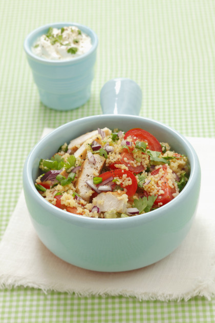 Couscous salad with grilled chicken breast, tomatoes and herbs
