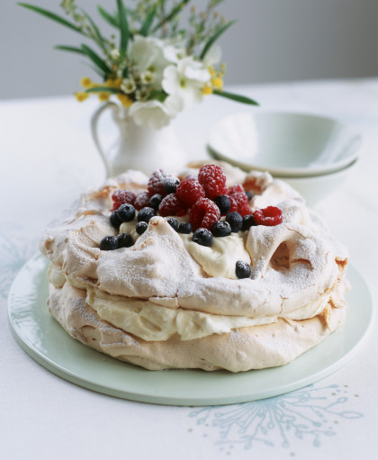 Pavlova with lemon cream and fresh berries