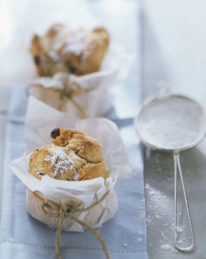 Small panettone with almonds and icing sugar