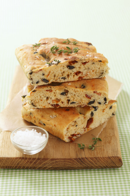 Focaccia with dried tomatoes, olives, thyme and sea salt