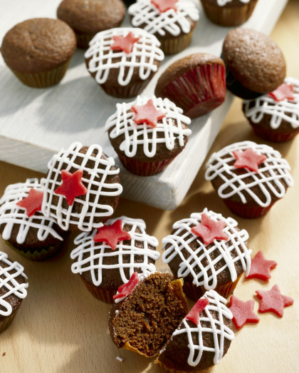 Decorated chocolate muffins with golden syrup