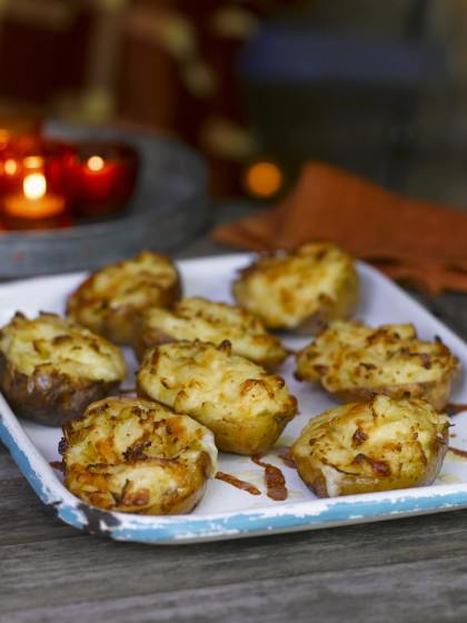 Baked potatoes topped with cheese