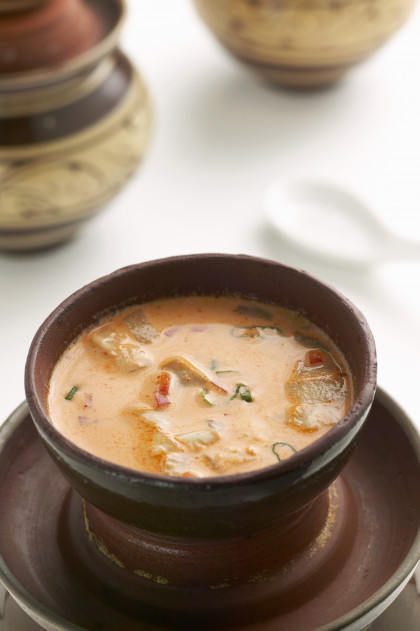 Red curry soup with coconut milk, chicken and oyster mushrooms