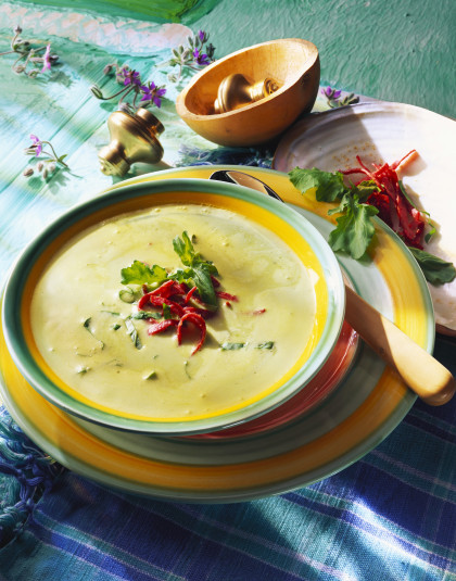 Cream of herb soup with salami strips