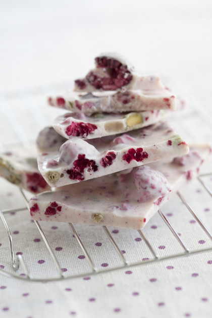 Home-made white raspberry chocolate with pistachios