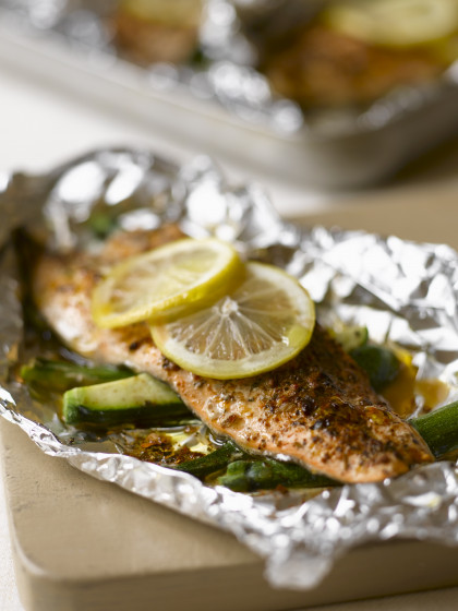 Trout with lemons and courgette in tin foil