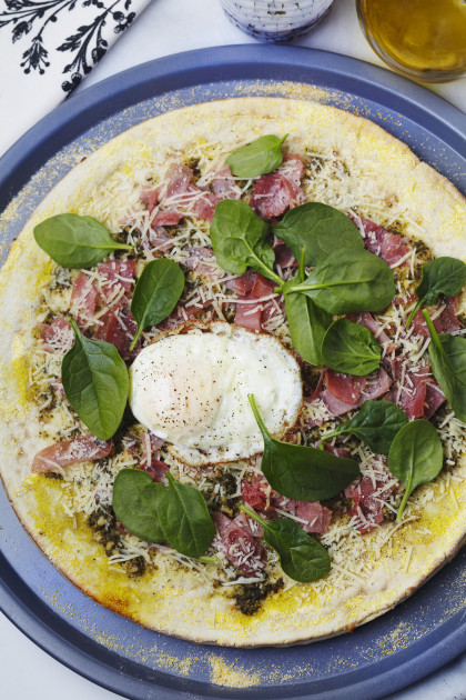 Ham pizza with fried egg