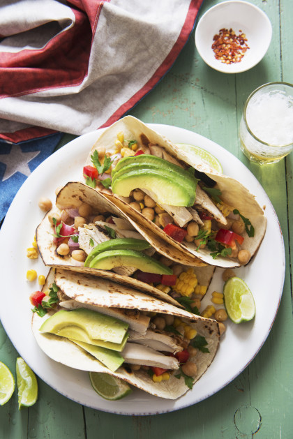 Tacos filled with chicken, chickpeas, sweetcorn and avocado