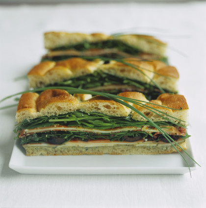 Focaccia sandwich with ham, spinach and cheese