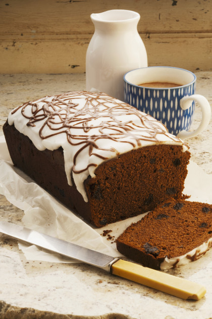 French chocolate cake with prunes and topped with icing sugar