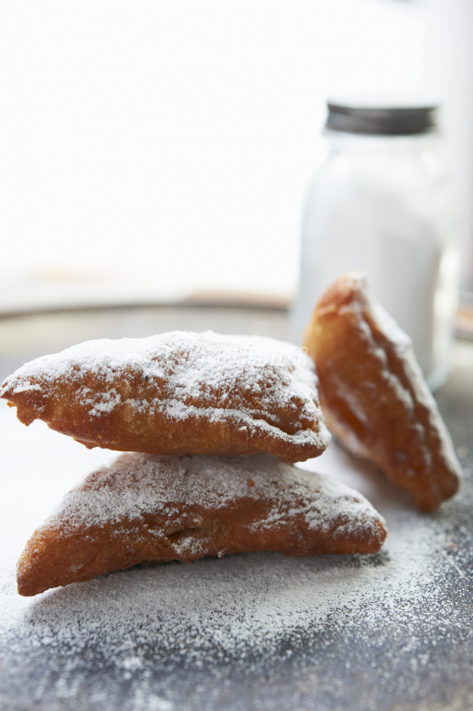Triangular beignets with icing sugar | preview