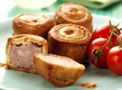 Gluten-free Small pork pies and fresh tomatoes