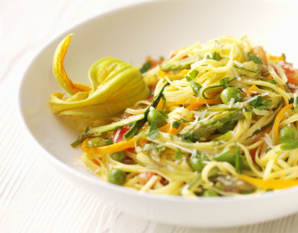 Gluten-free Egg pasta with summer vegetables and courgette flowers