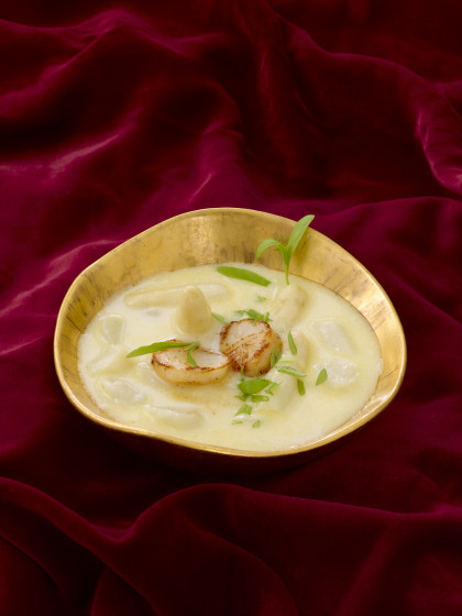 Cream of asparagus soup with scallops