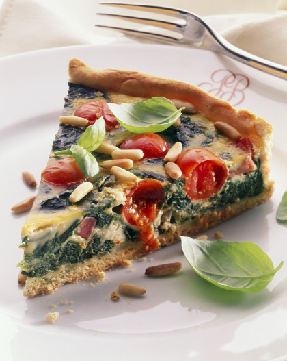 Spinach and tomato quiche with pine nuts and basil