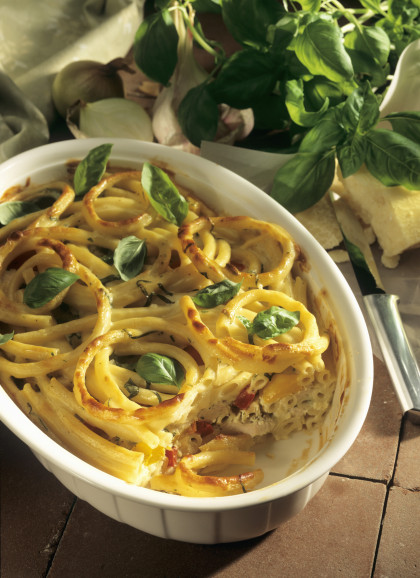 Gluten-free, dairy-free Pasta bake with peppers and basil leaves