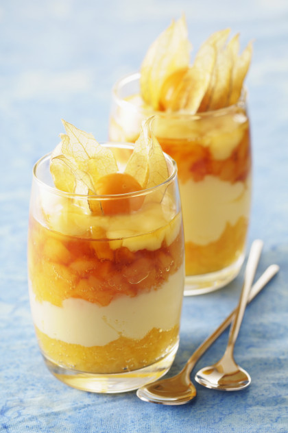 Layered dessert with apricots, caramel mousse and physalis