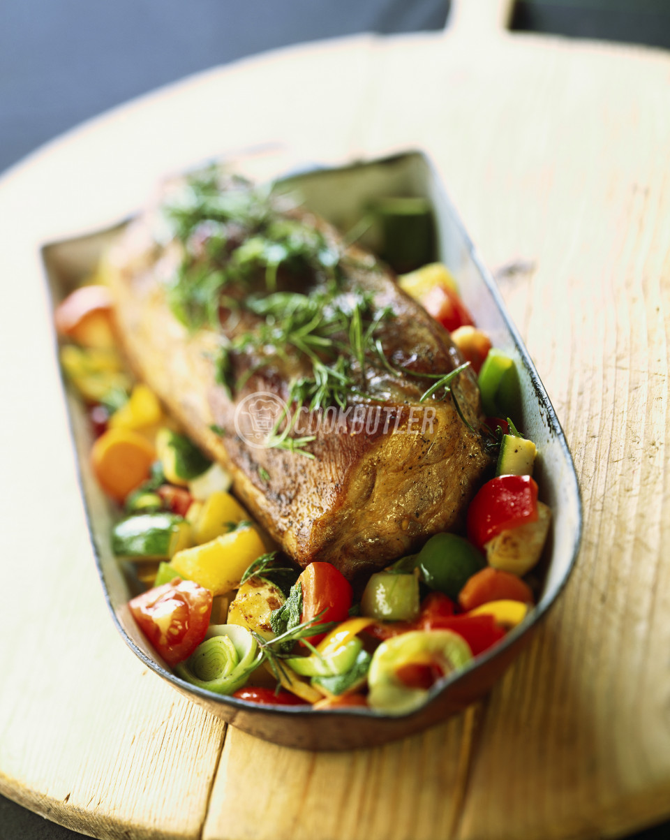 Roast pork neck Provencal style on bed of vegetables | preview