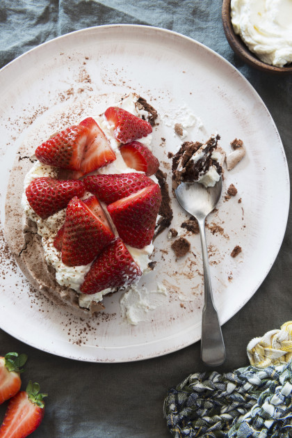 Chocolate pavlova with strawberries and cream