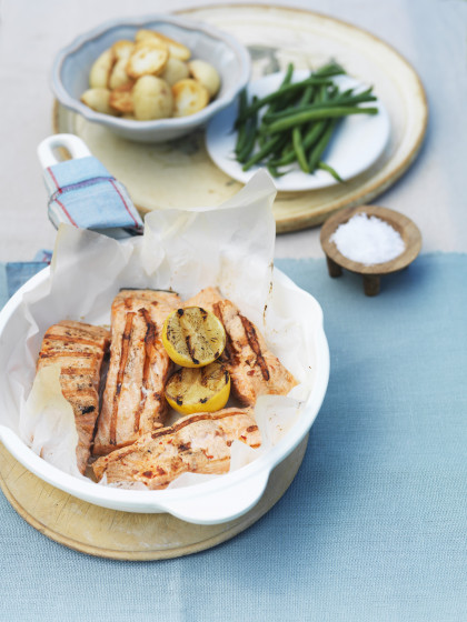 Grilled salmon slices with fried potatoes and beans