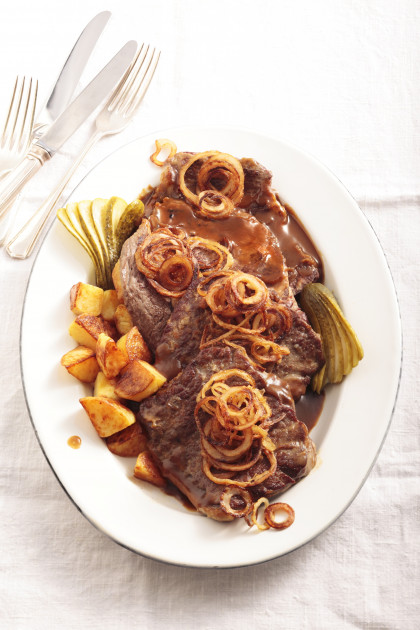 Fried beef steak with fried onions