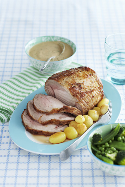 Roast pork with potatoes and green vegetables