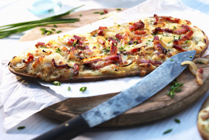 Tarte flambée with bacon, onions, spring onions and cheese (gluten-free)