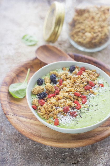 Green smoothie with granola and superfoods