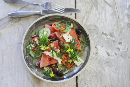 Rocket salad with watermelon, olives, cucumber and sheep's cheese