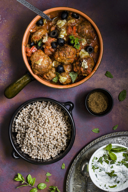 Moroccan lamb meatballs in a spicy tomato sauce with caraway, garlic and olives (gluten-free)