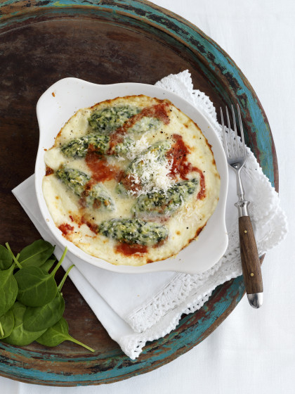Malfatti (Italian spinach dumplings) with cheese and tomato sauce (gluten-free)