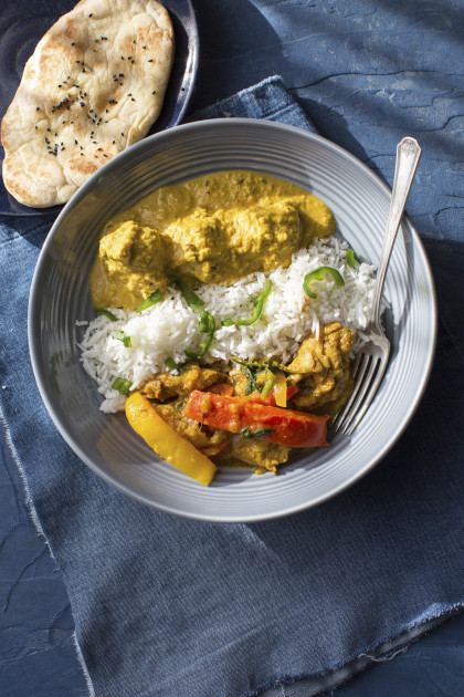 Chicken jalfrezi and chicken korma with rice and naan bread (India) (gluten-free)