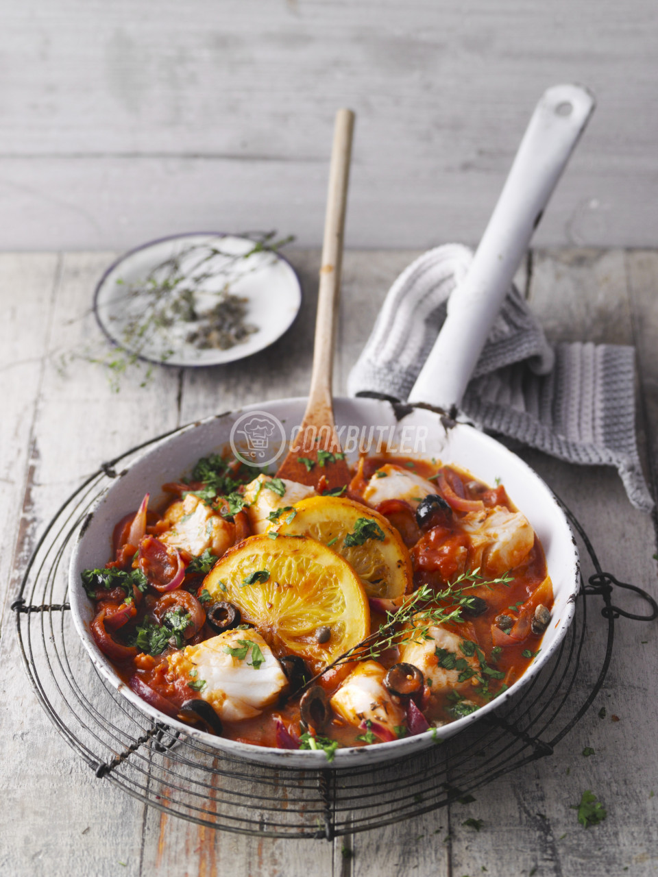 Sicilian fish dish with tomatoes, olives and capers | preview