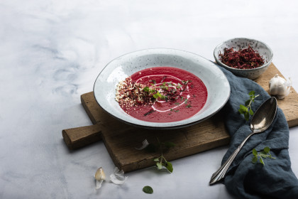 Vegan beetroot soup with puffed quinoa, beetroot crunch and marjoram