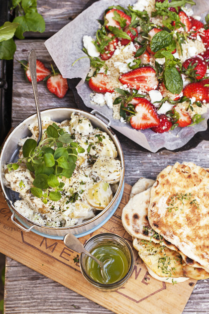 Potato salad, couscous with strawberries and grilled flatbread