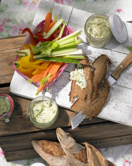 Vegetable sticks with bread and herb butter for summer picnic